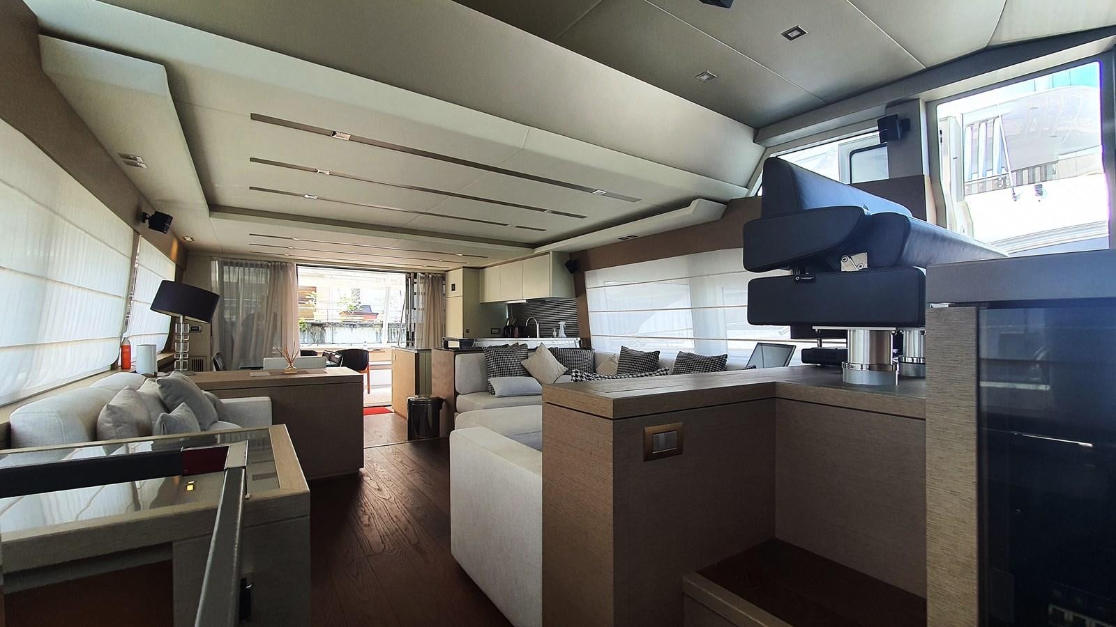 a room with a couch and a table aboard NEW FISH Yacht for Sale