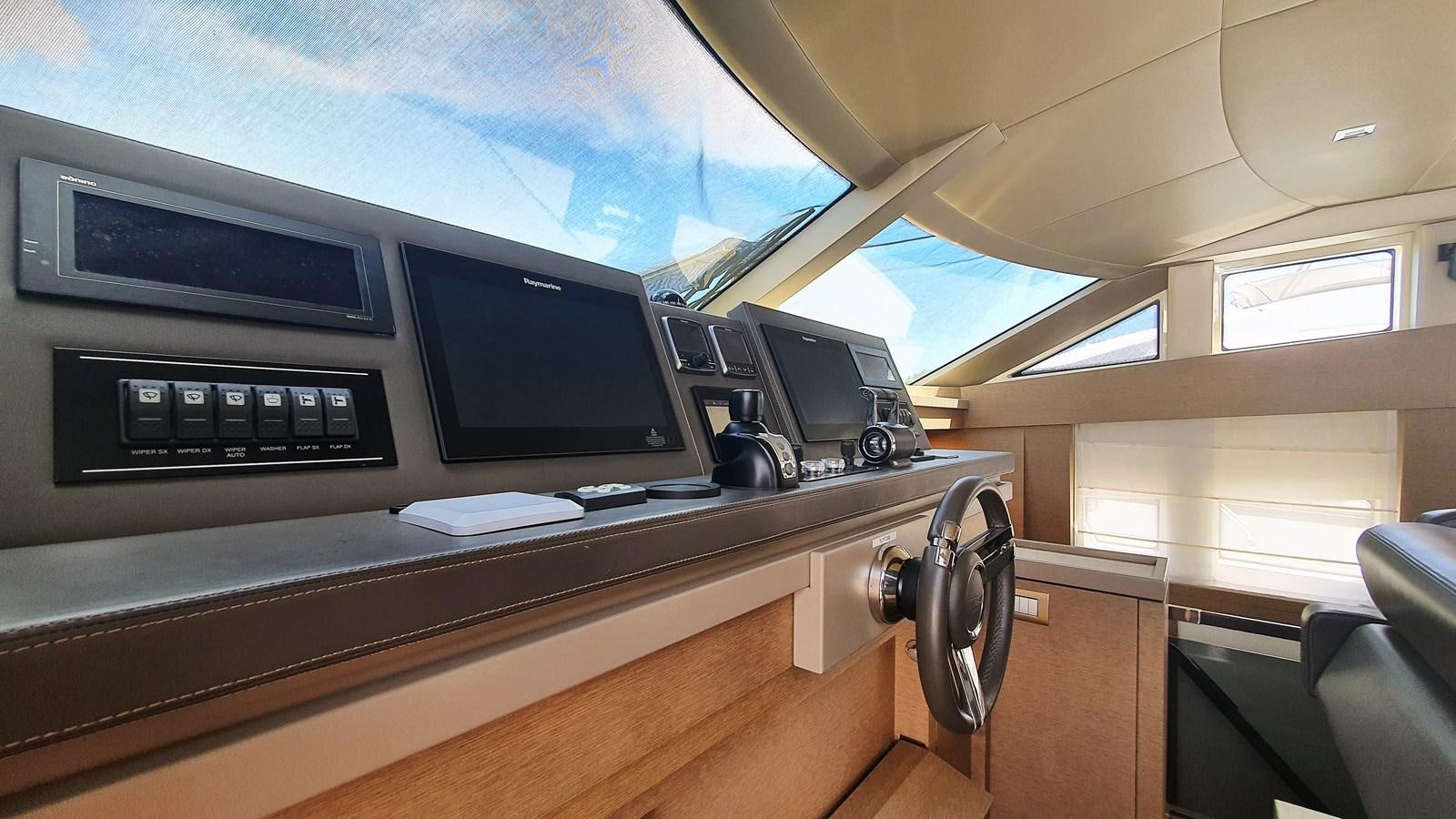 a room with a desk and computer aboard NEW FISH Yacht for Sale