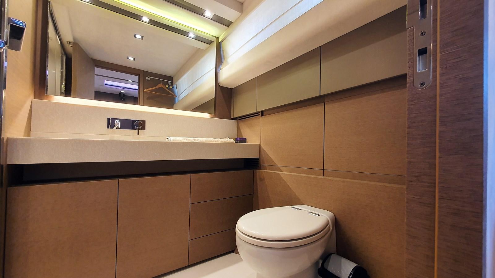 a bathroom with a toilet and a mirror aboard NEW FISH Yacht for Sale