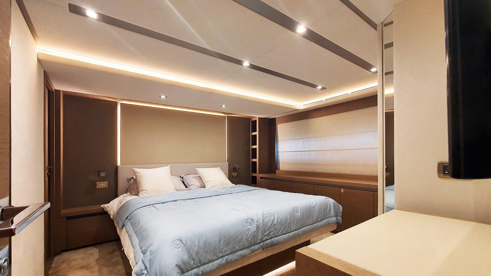 a room with a bed and a desk aboard NEW FISH Yacht for Sale