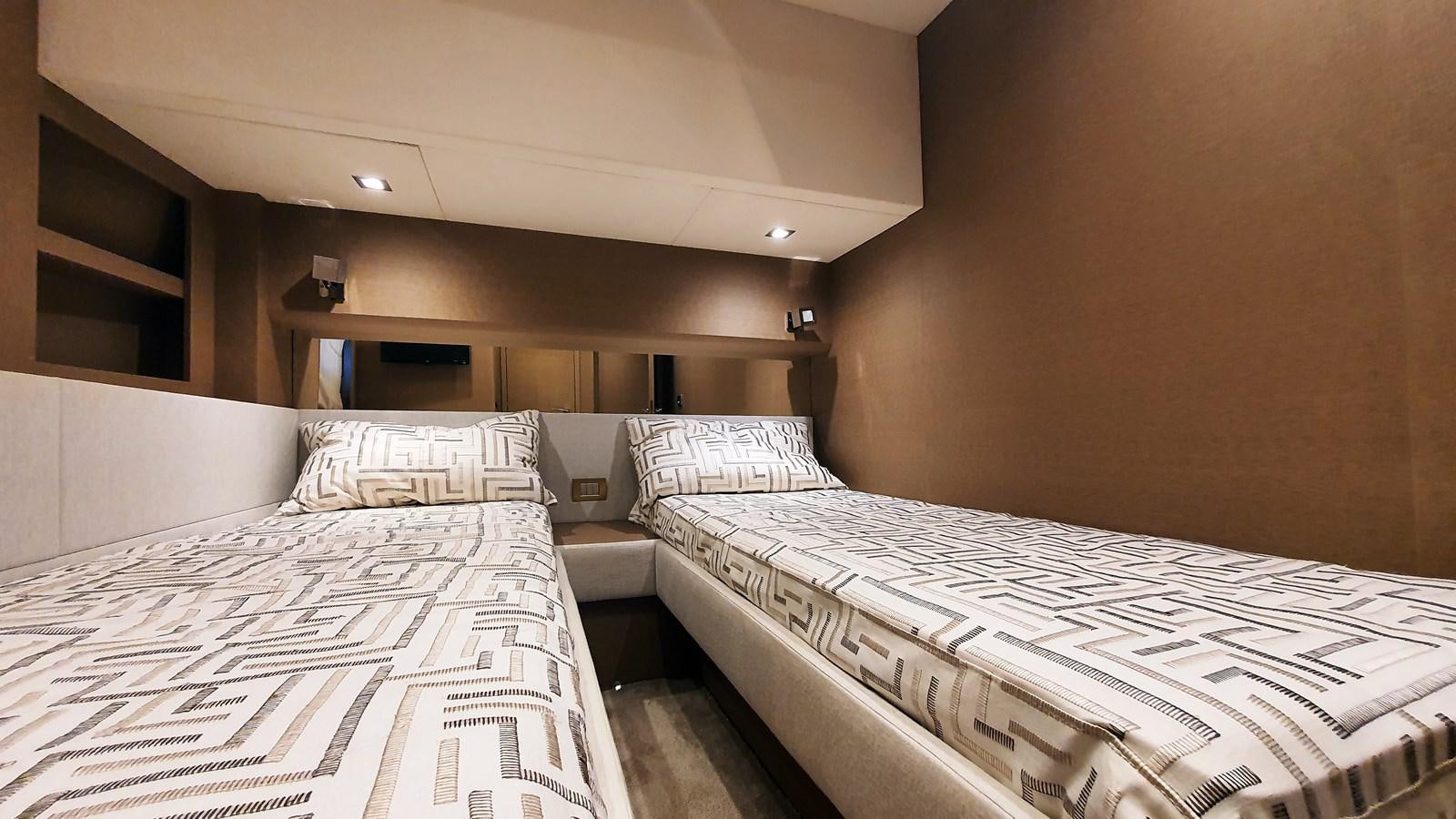 a room with beds and a tv aboard NEW FISH Yacht for Sale