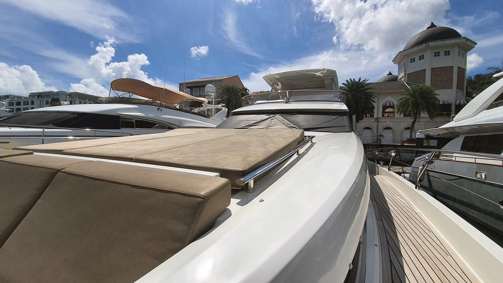 a rooftop with a group of buildings and trees in the background aboard NEW FISH Yacht for Sale