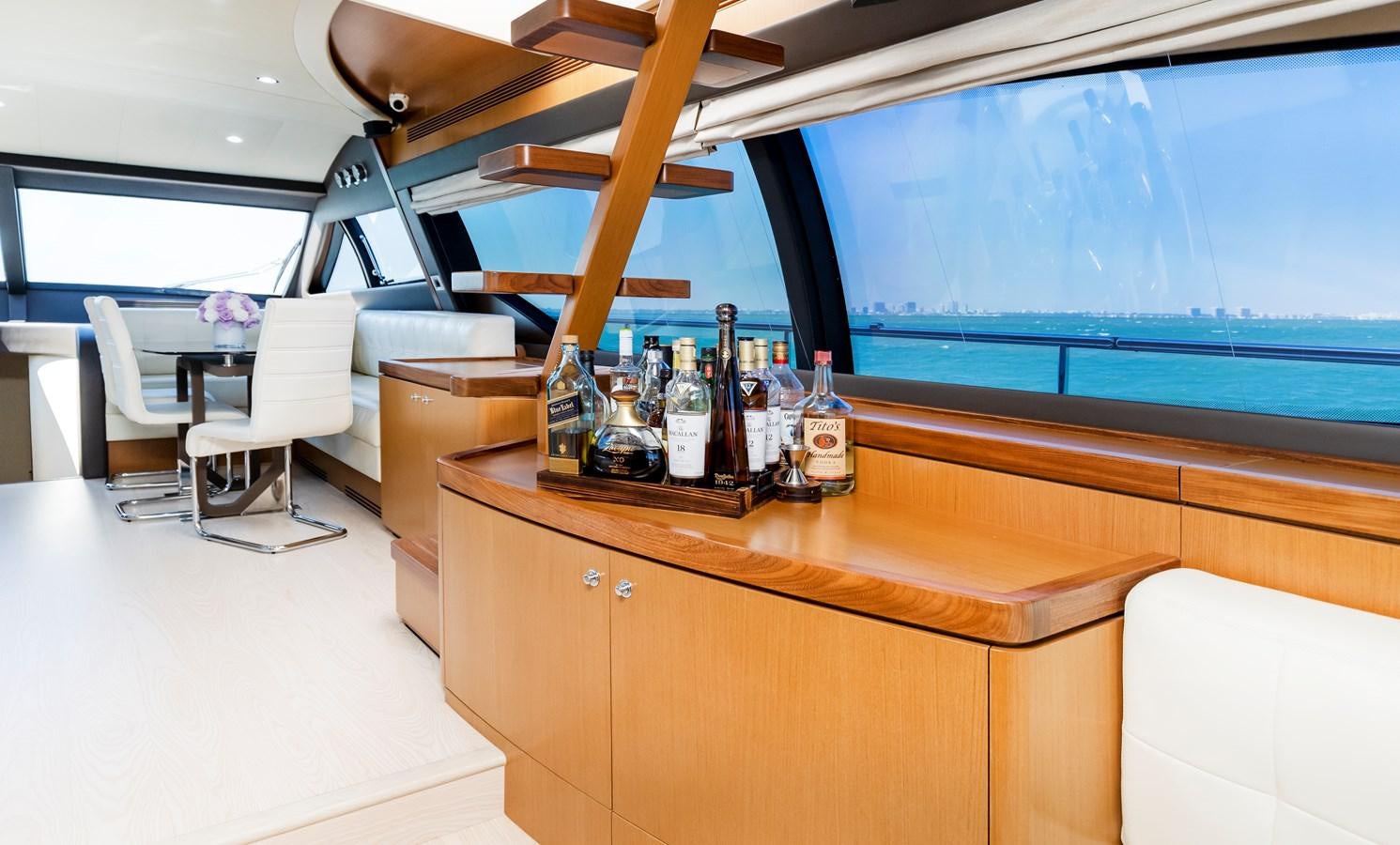 a room with a table and chairs aboard HOPE Yacht for Sale