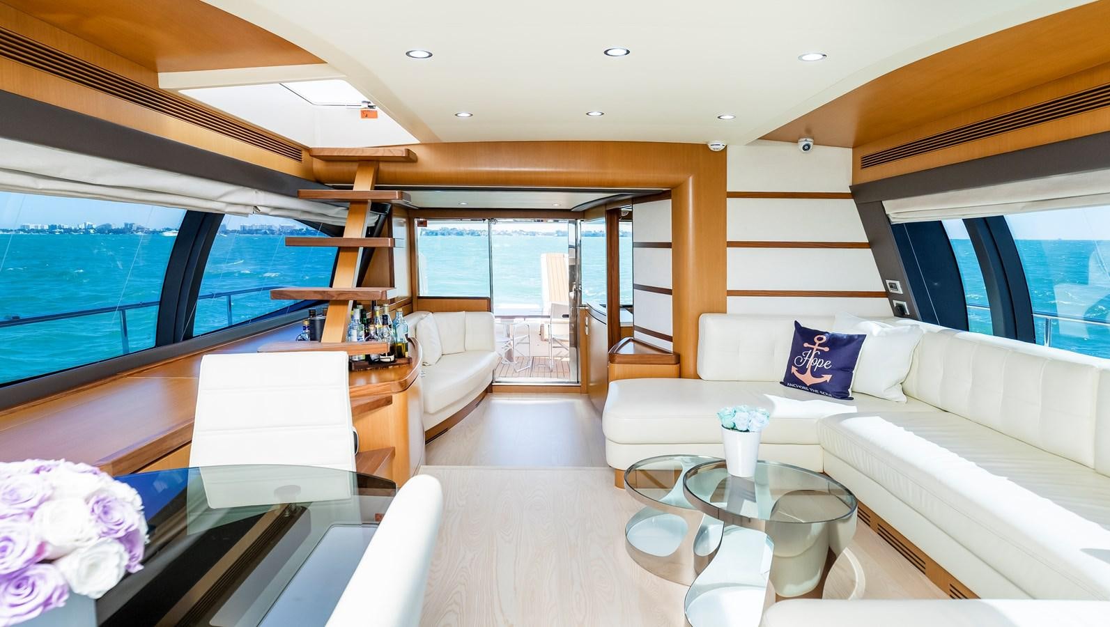 a living room with a large window aboard HOPE Yacht for Sale