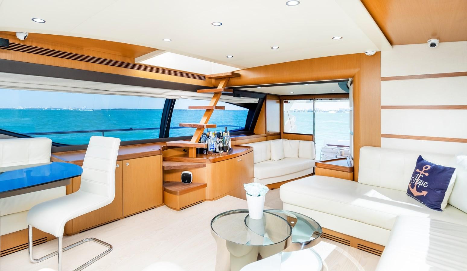 a room with a bed and a table aboard HOPE Yacht for Sale