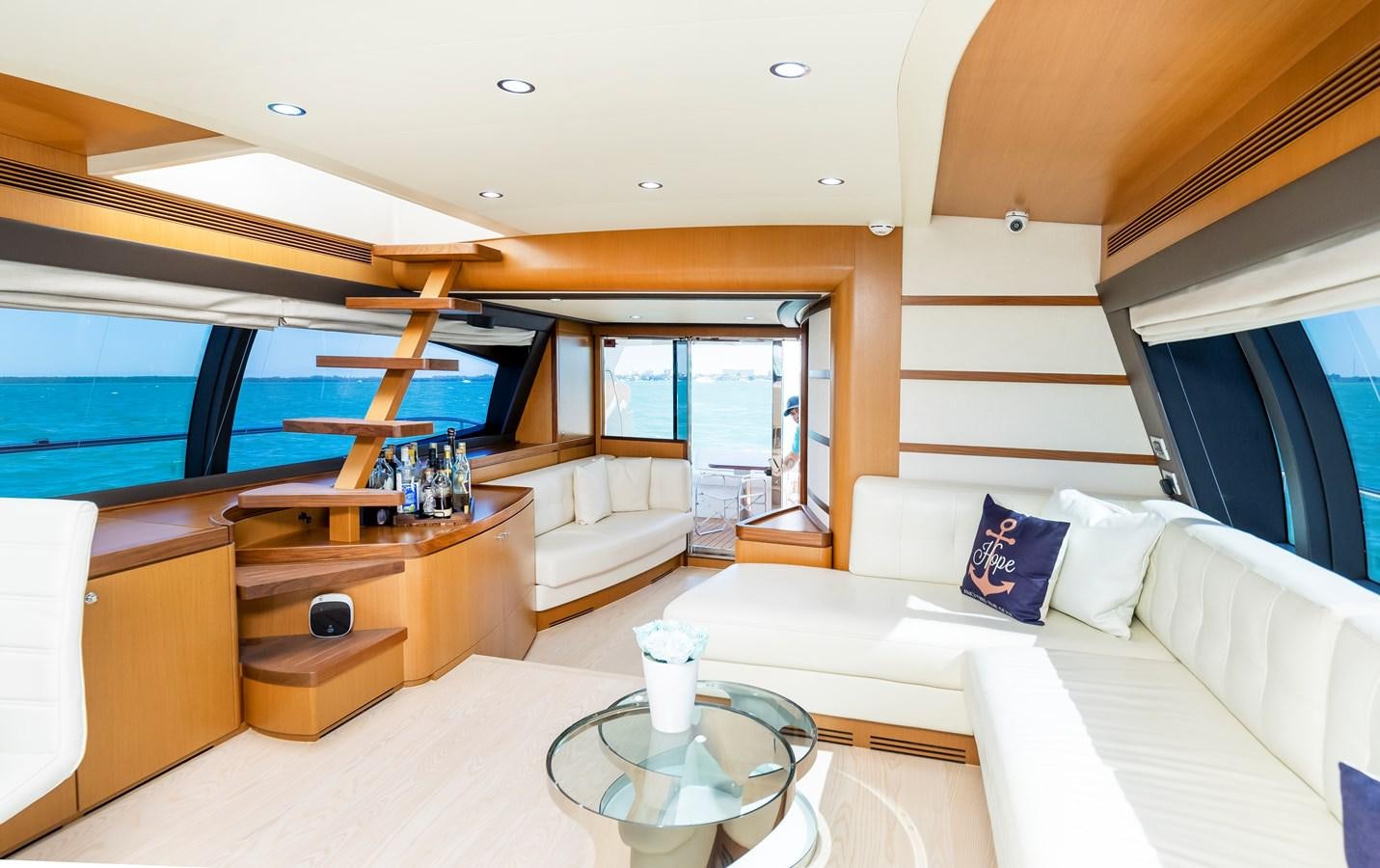 a room with a couch and a table aboard HOPE Yacht for Sale