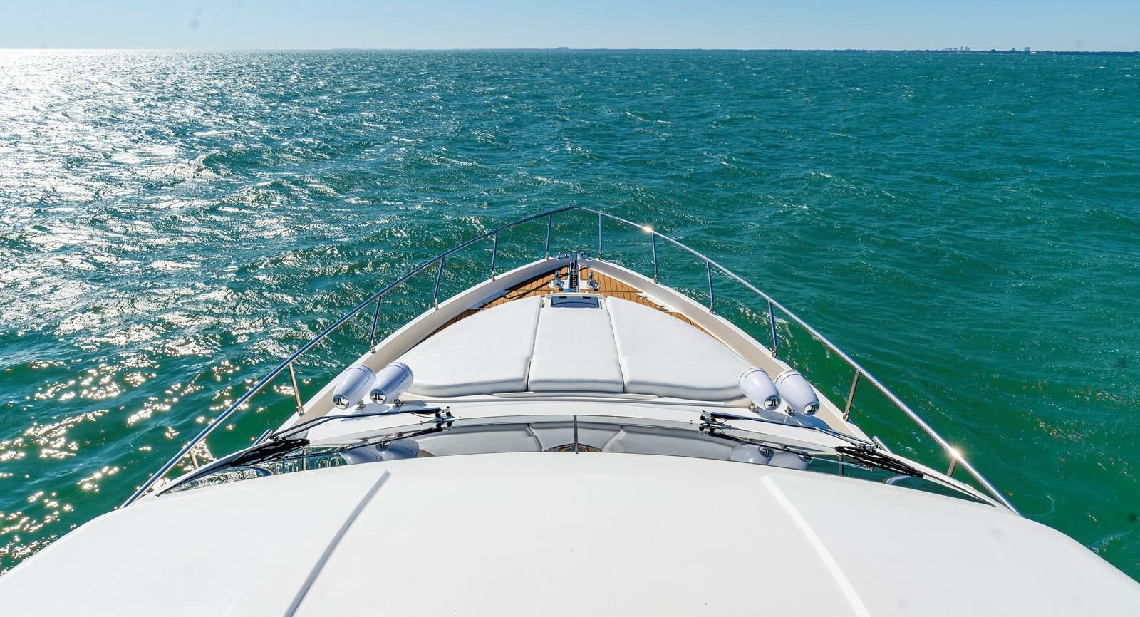 a white boat in the water aboard HOPE Yacht for Sale