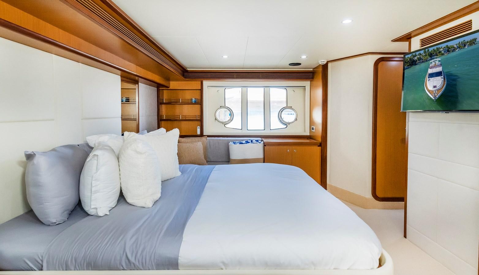 a bed with white sheets aboard HOPE Yacht for Sale