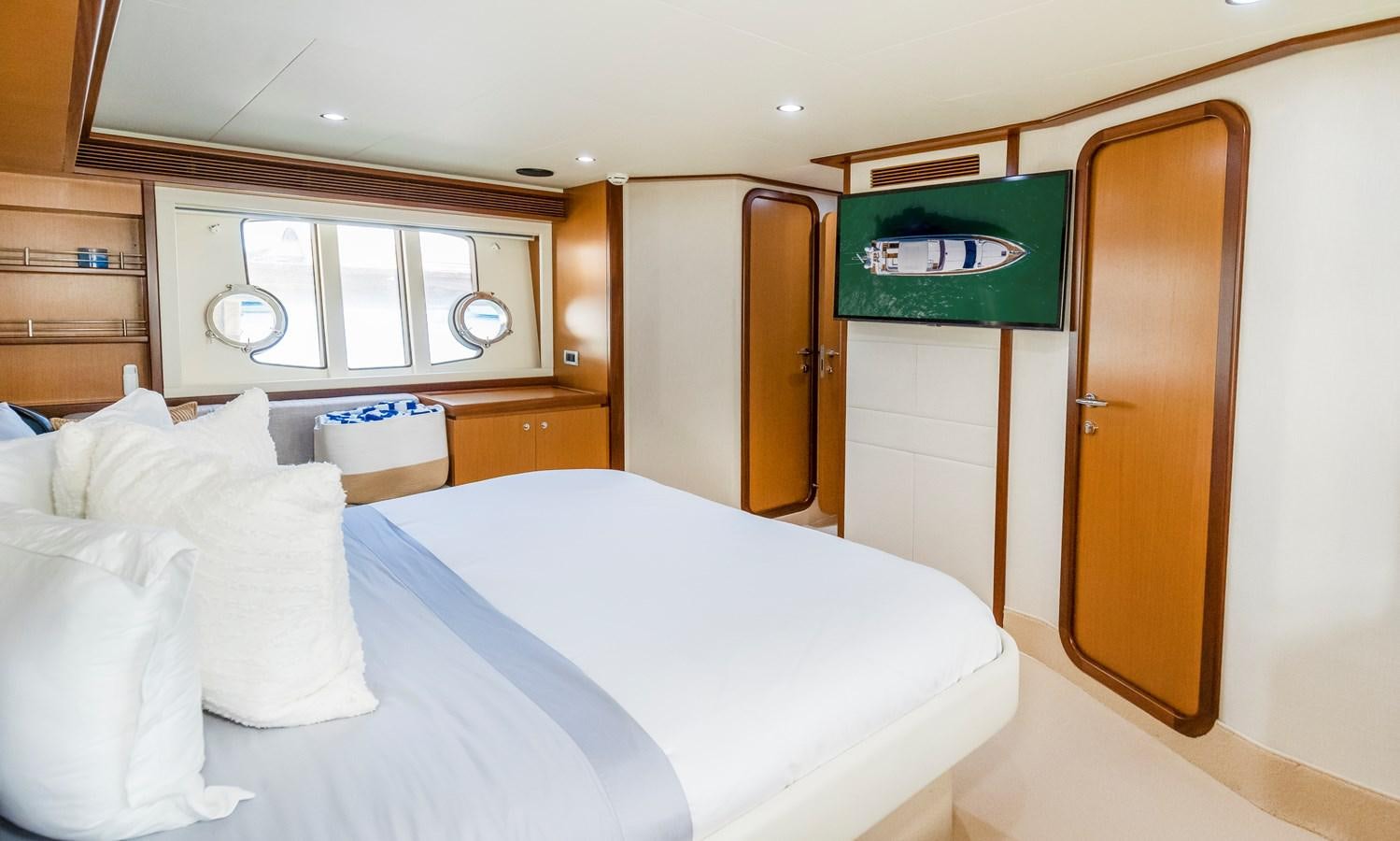a room with a bed and a window aboard HOPE Yacht for Sale