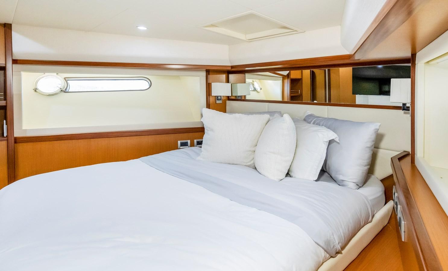 a bed with white sheets aboard HOPE Yacht for Sale