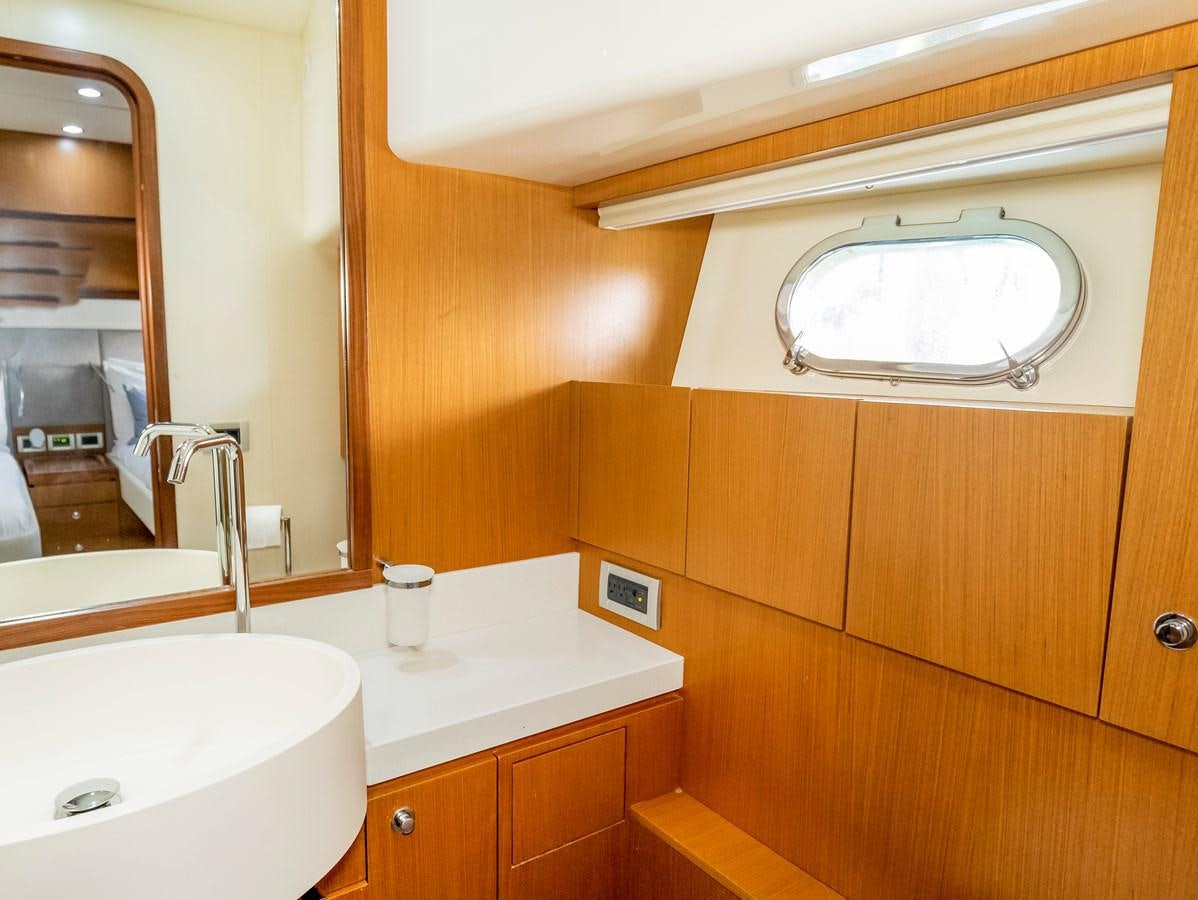 a bathroom with a sink and a mirror aboard HOPE Yacht for Sale