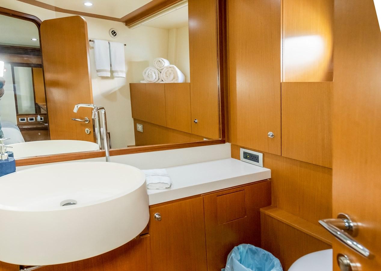 a bathroom with a large mirror aboard HOPE Yacht for Sale
