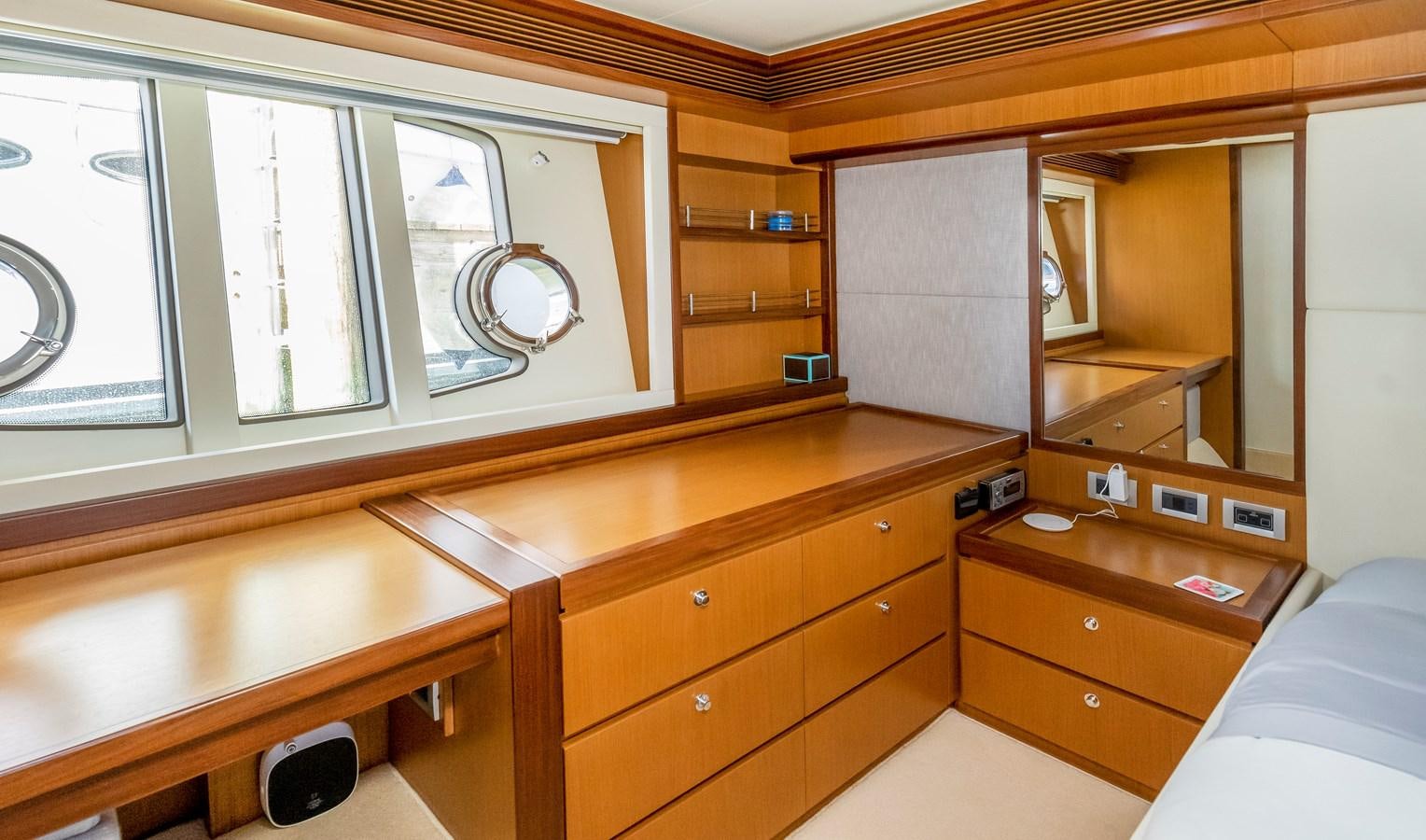 a room with a bed and a desk aboard HOPE Yacht for Sale