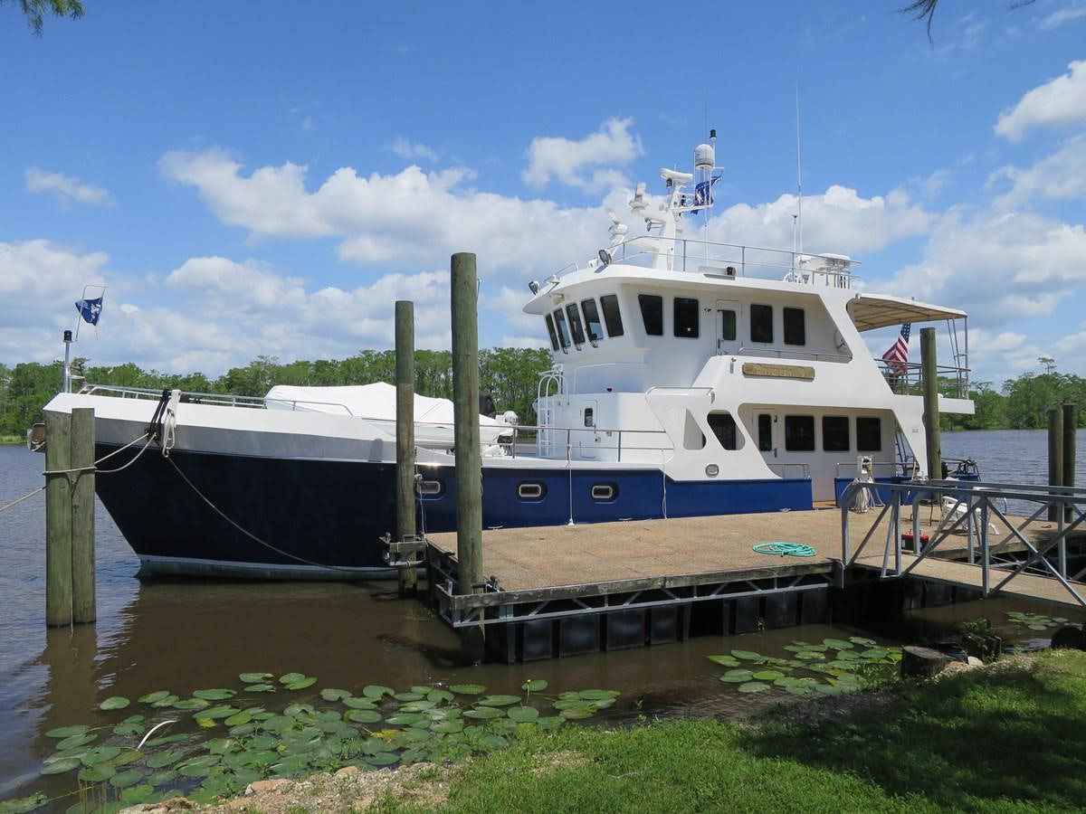 a boat docked at a pier aboard PATRICIA D Yacht for Sale