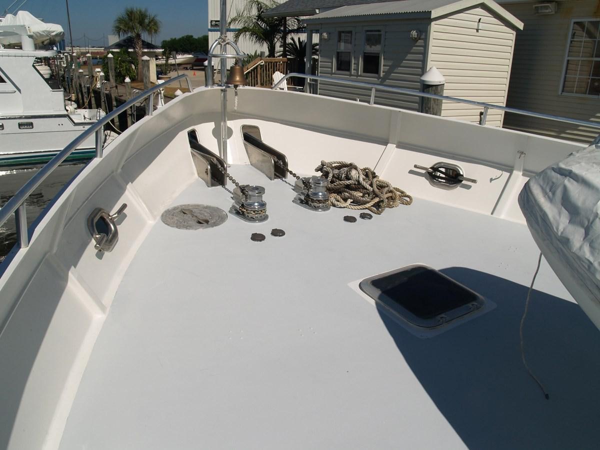 a white boat with a black object on it aboard PATRICIA D Yacht for Sale