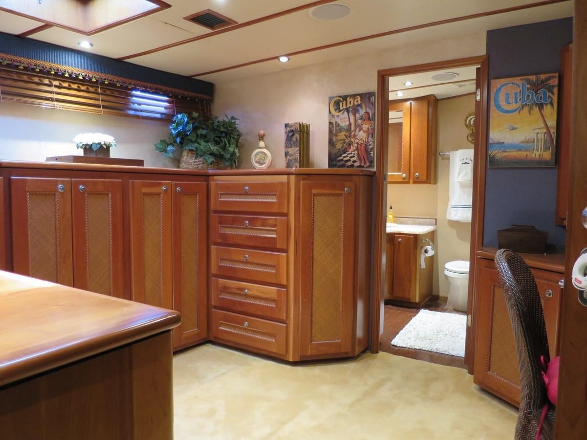 a bathroom with wooden cabinets aboard PATRICIA D Yacht for Sale
