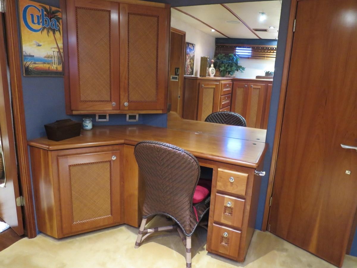 a kitchen with a bar stool aboard PATRICIA D Yacht for Sale