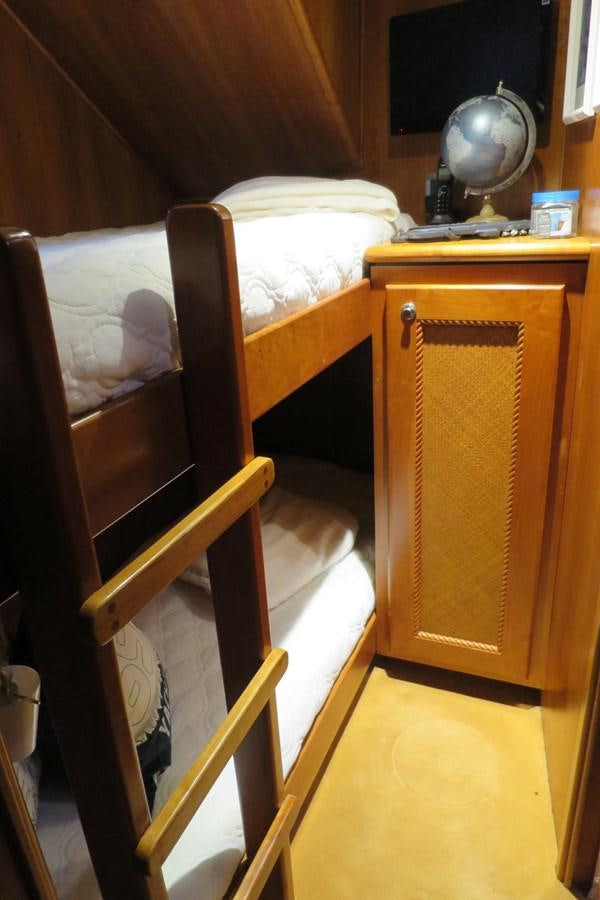 a wooden cabinet in a room aboard PATRICIA D Yacht for Sale