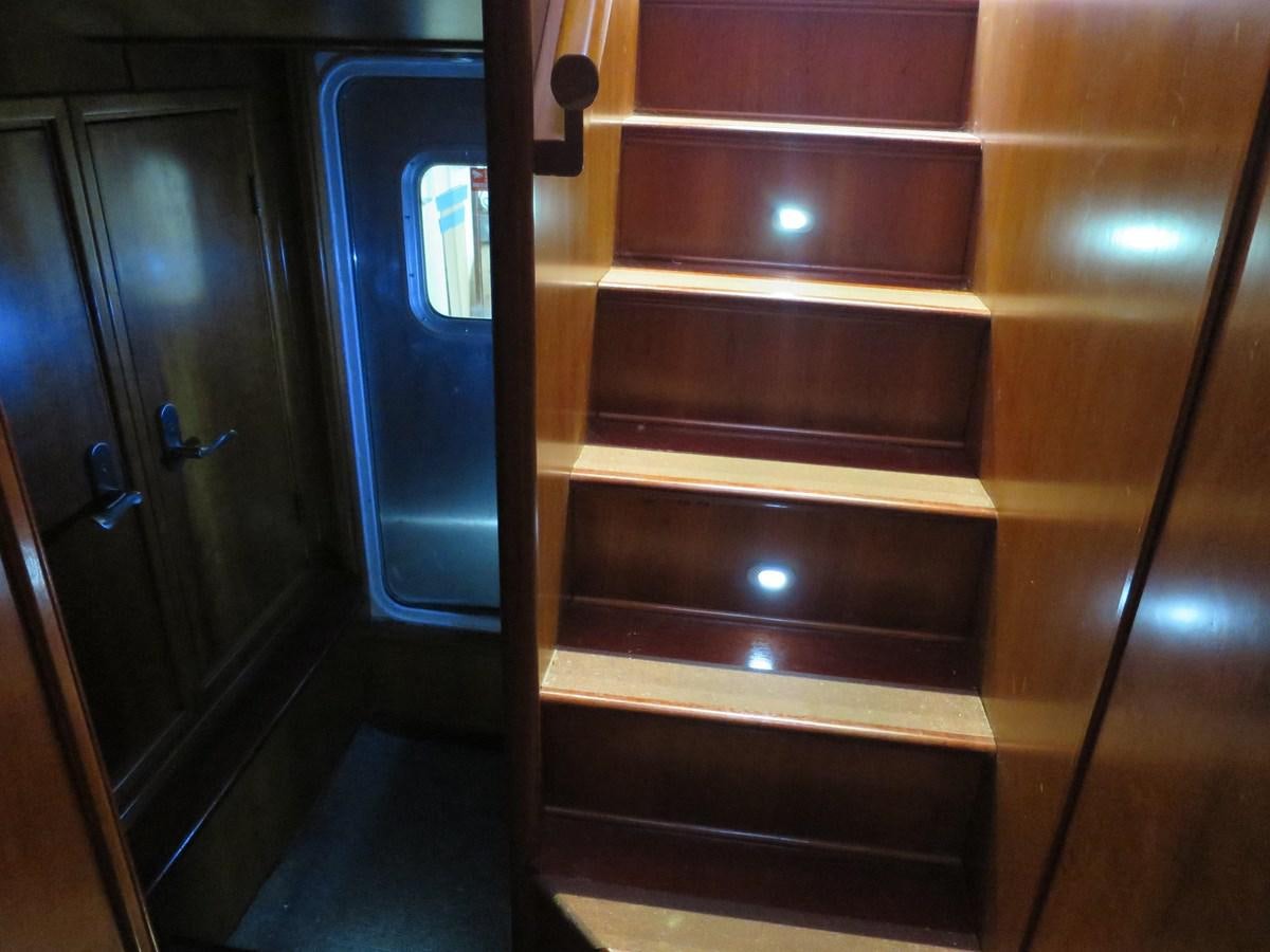 a wooden cabinet with drawers aboard PATRICIA D Yacht for Sale