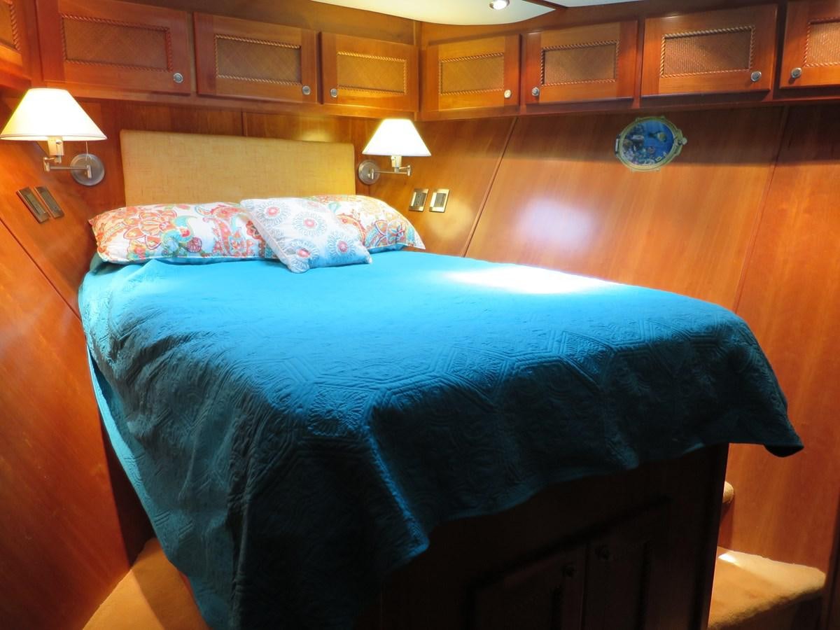 a bed in a room aboard PATRICIA D Yacht for Sale