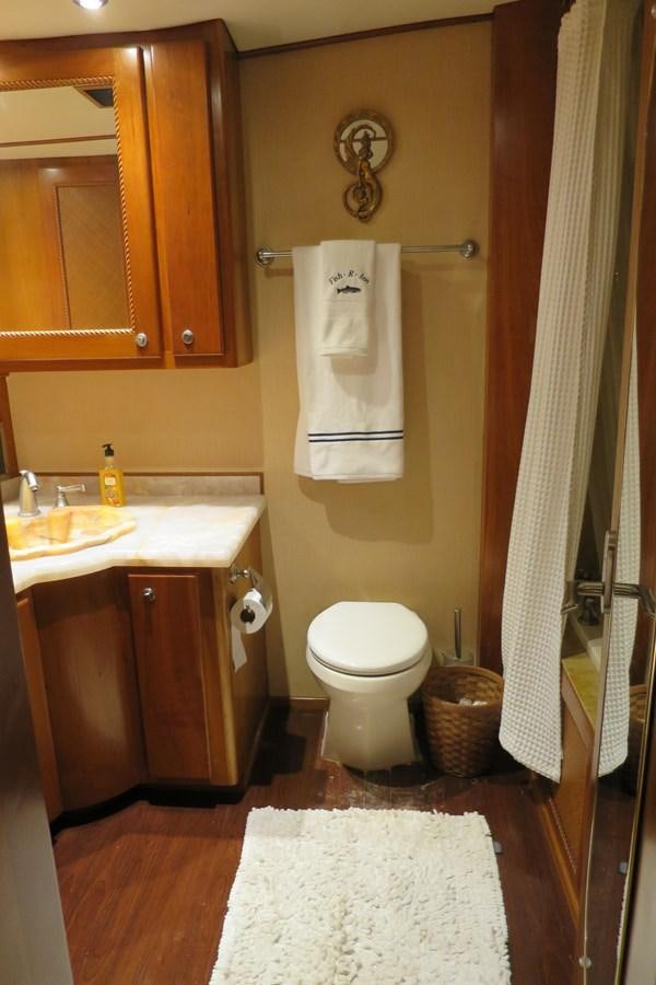 a bathroom with a toilet and sink aboard PATRICIA D Yacht for Sale