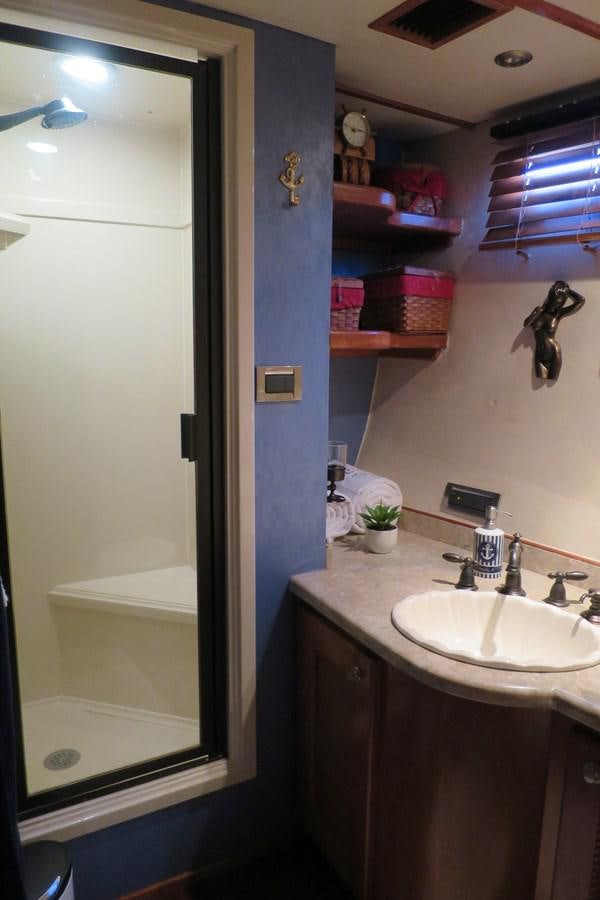 a bathroom with a sink and a mirror aboard PATRICIA D Yacht for Sale