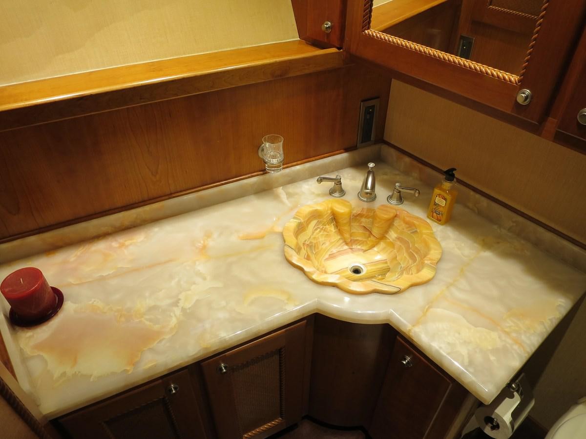 a sink with a large mirror aboard PATRICIA D Yacht for Sale