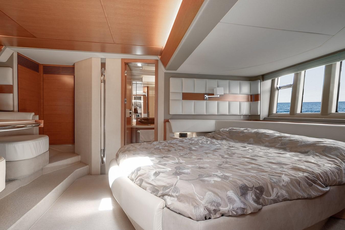 a large bedroom with a large bed aboard ELENA I Yacht for Sale