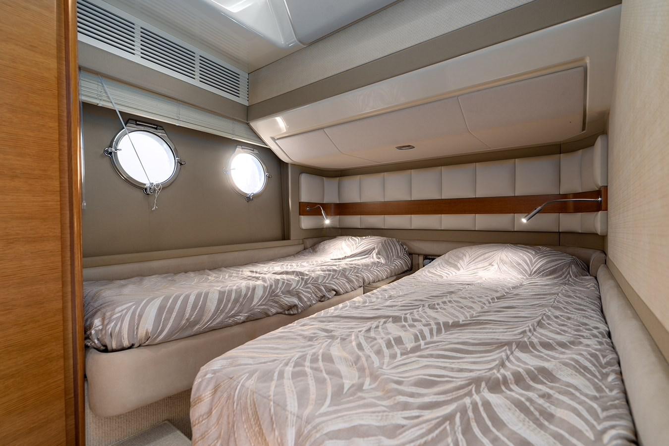 a room with two beds aboard ELENA I Yacht for Sale
