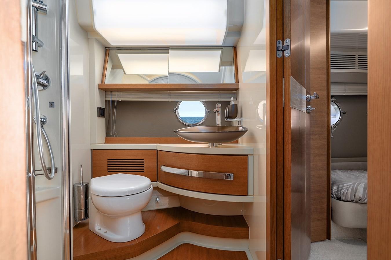 a bathroom with a sink and toilet aboard ELENA I Yacht for Sale
