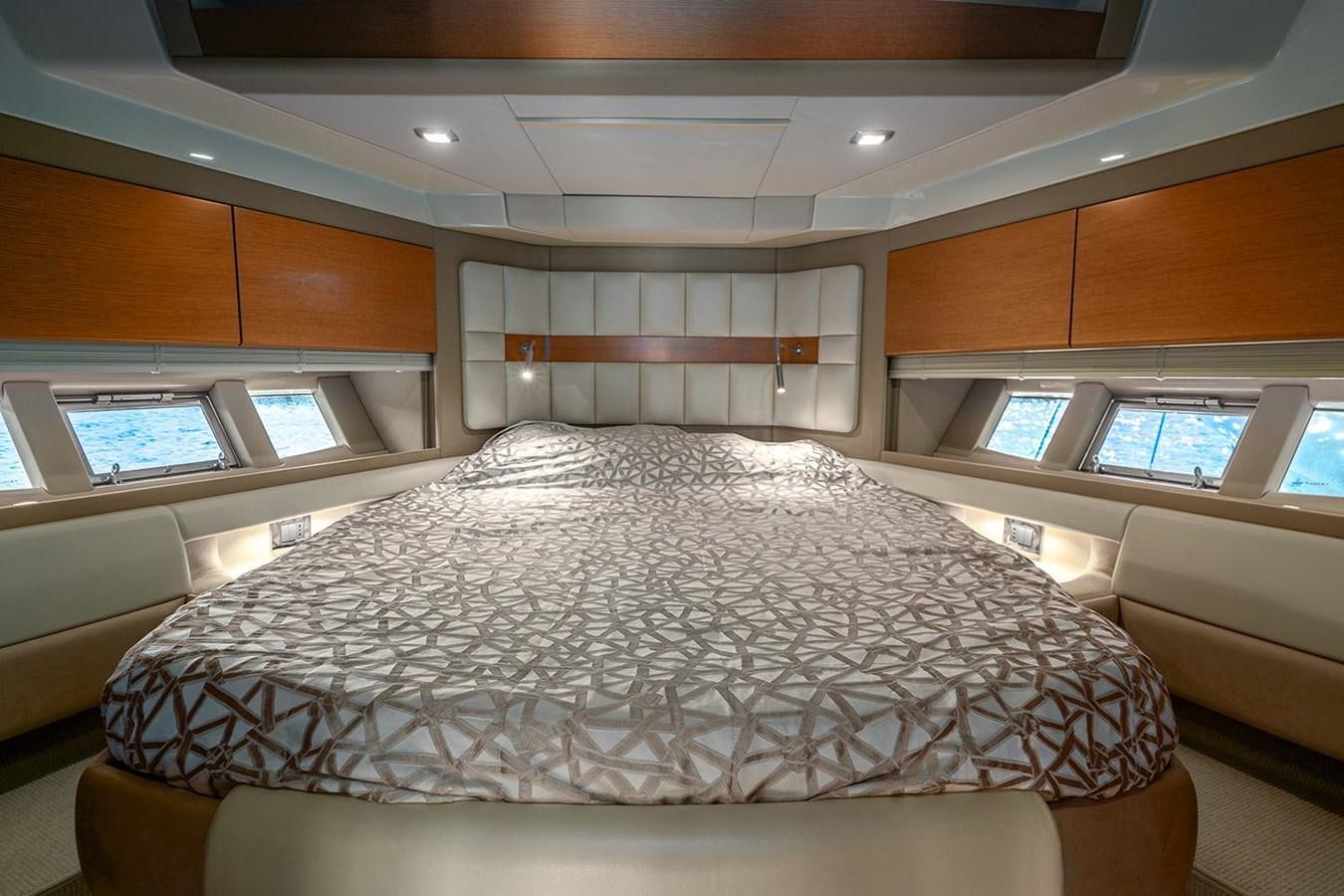 a large bed in a room aboard ELENA I Yacht for Sale
