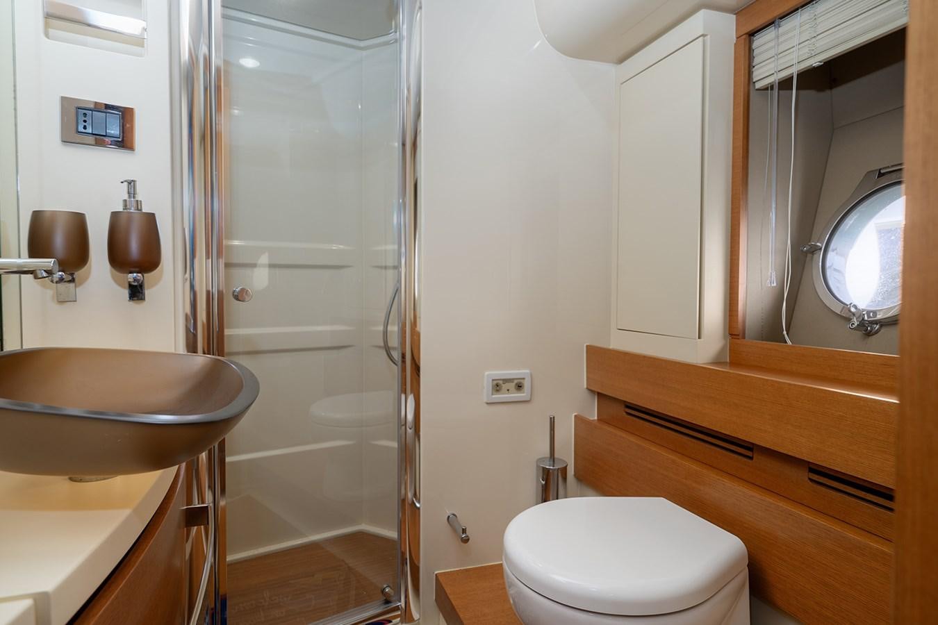 a bathroom with a glass shower aboard ELENA I Yacht for Sale