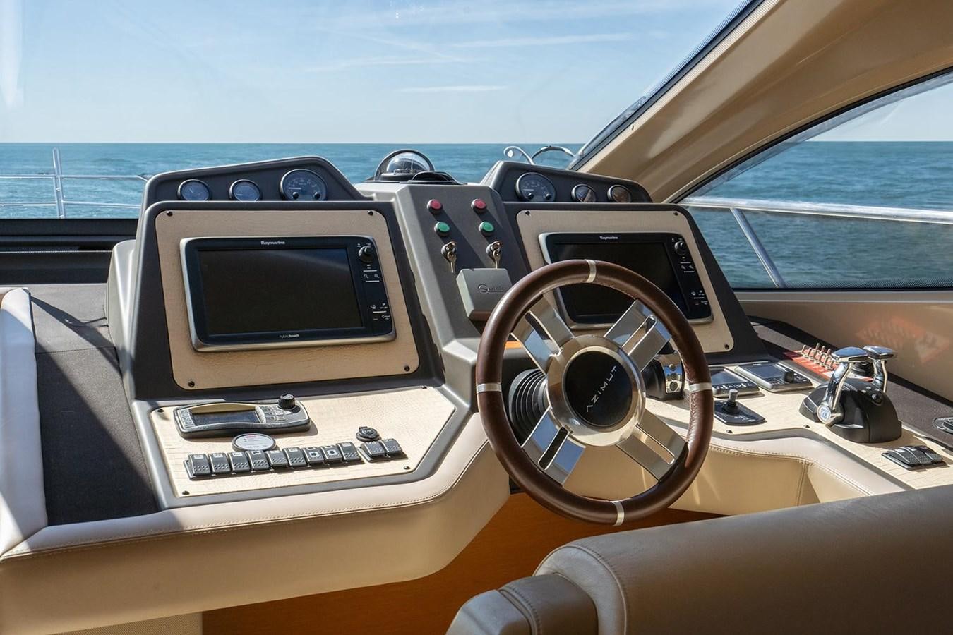 a car with a radio and a steering wheel aboard ELENA I Yacht for Sale