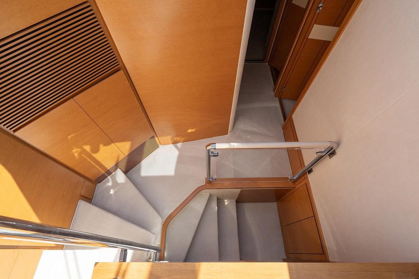 a staircase with a metal railing aboard ELENA I Yacht for Sale