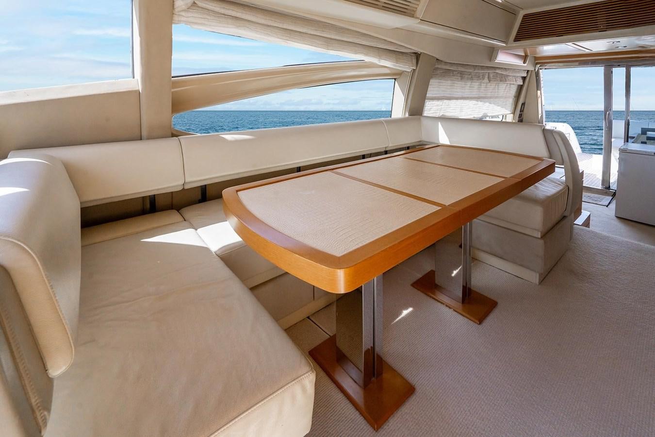 a room with a table and chairs aboard ELENA I Yacht for Sale