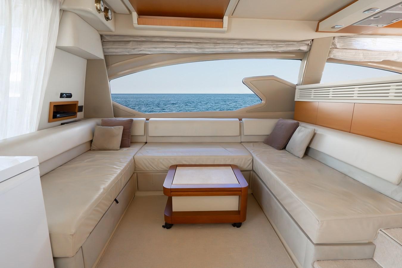 a room with a couch and a table aboard ELENA I Yacht for Sale