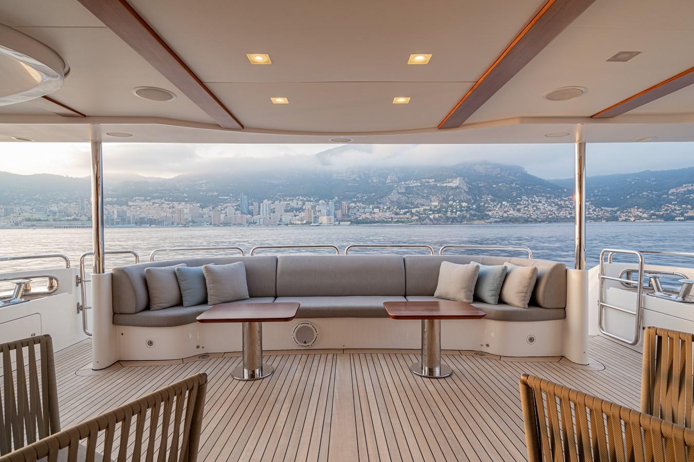 a large living room with a view of the city aboard EDESIA Yacht for Sale
