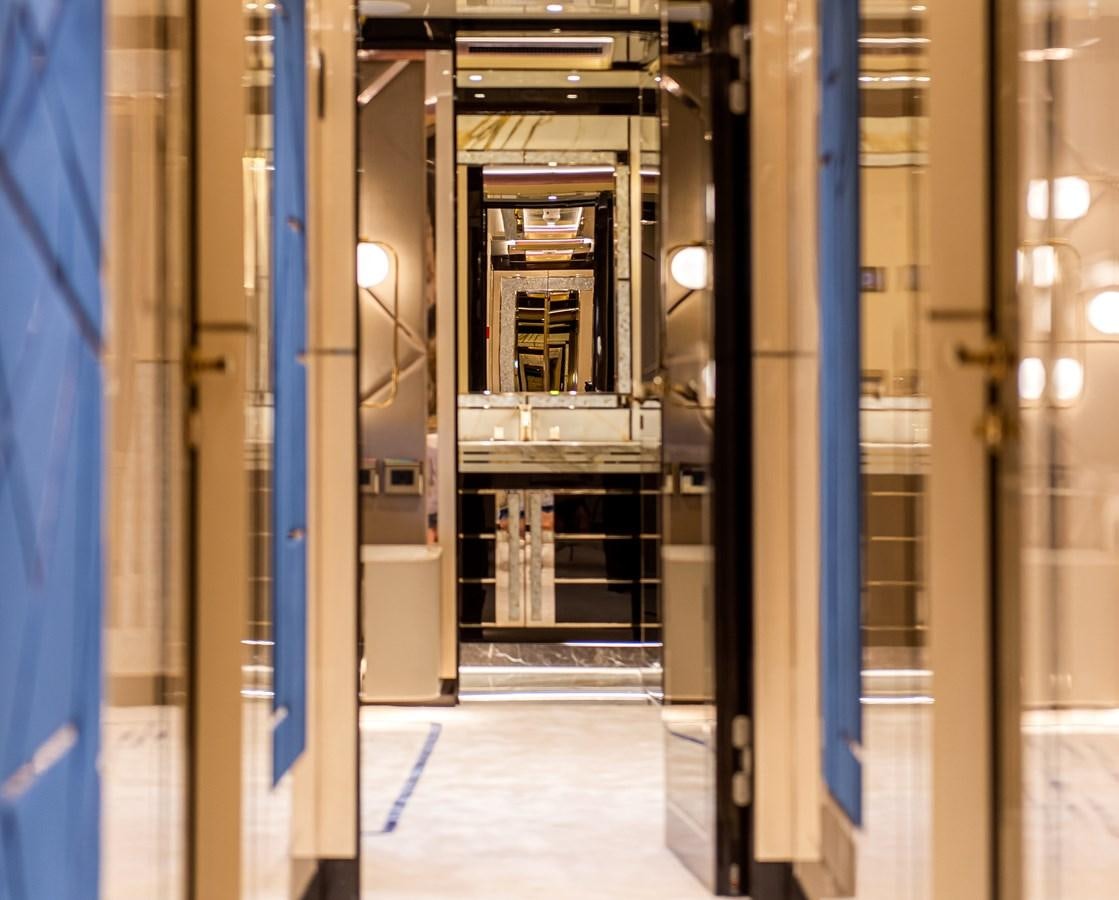 a room with a blue wall and a machine inside aboard STEFANIA Yacht for Sale