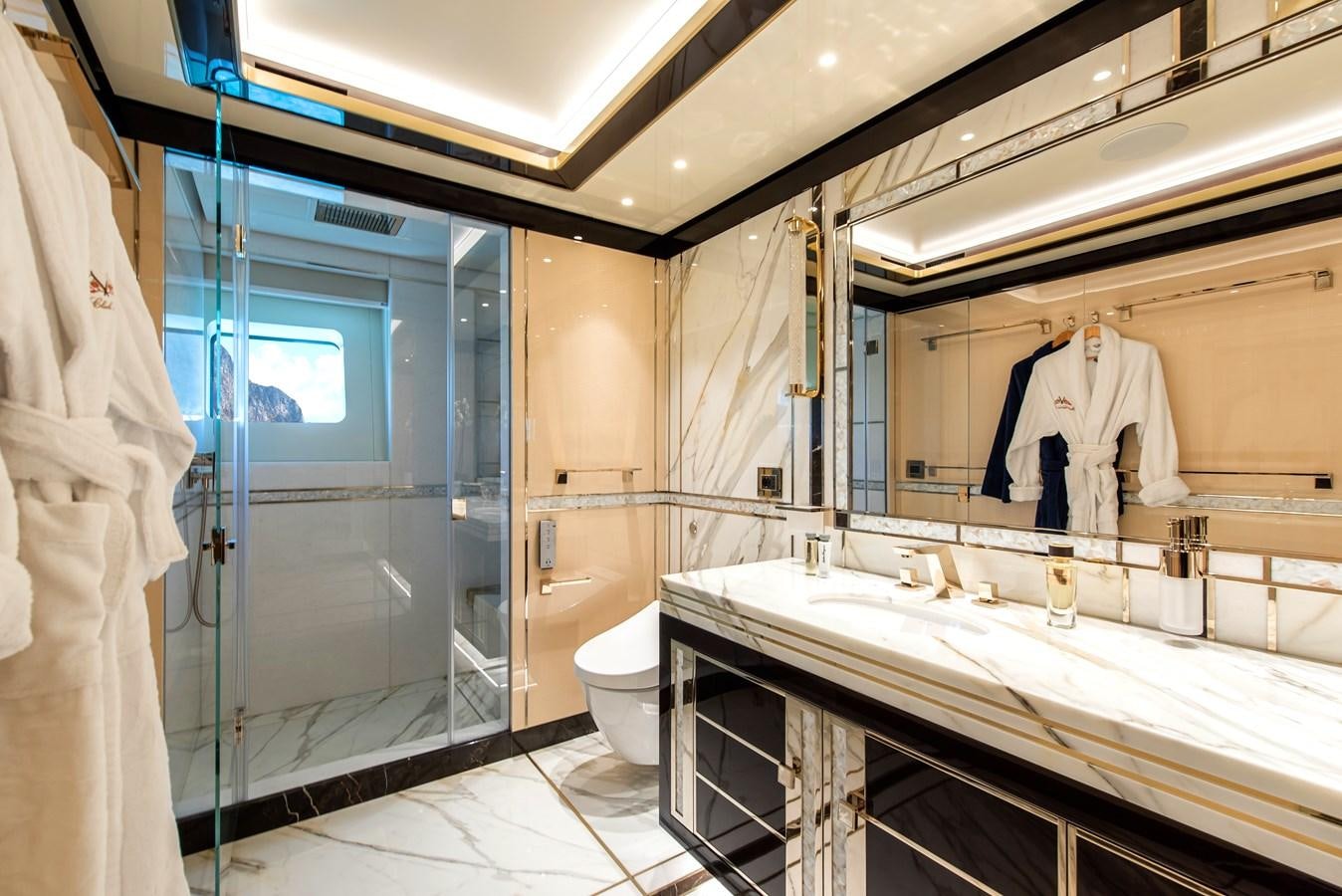 a bathroom with a tub sink and toilet aboard STEFANIA Yacht for Sale