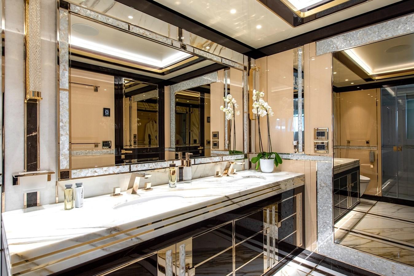 a large bathroom with a large mirror aboard STEFANIA Yacht for Sale