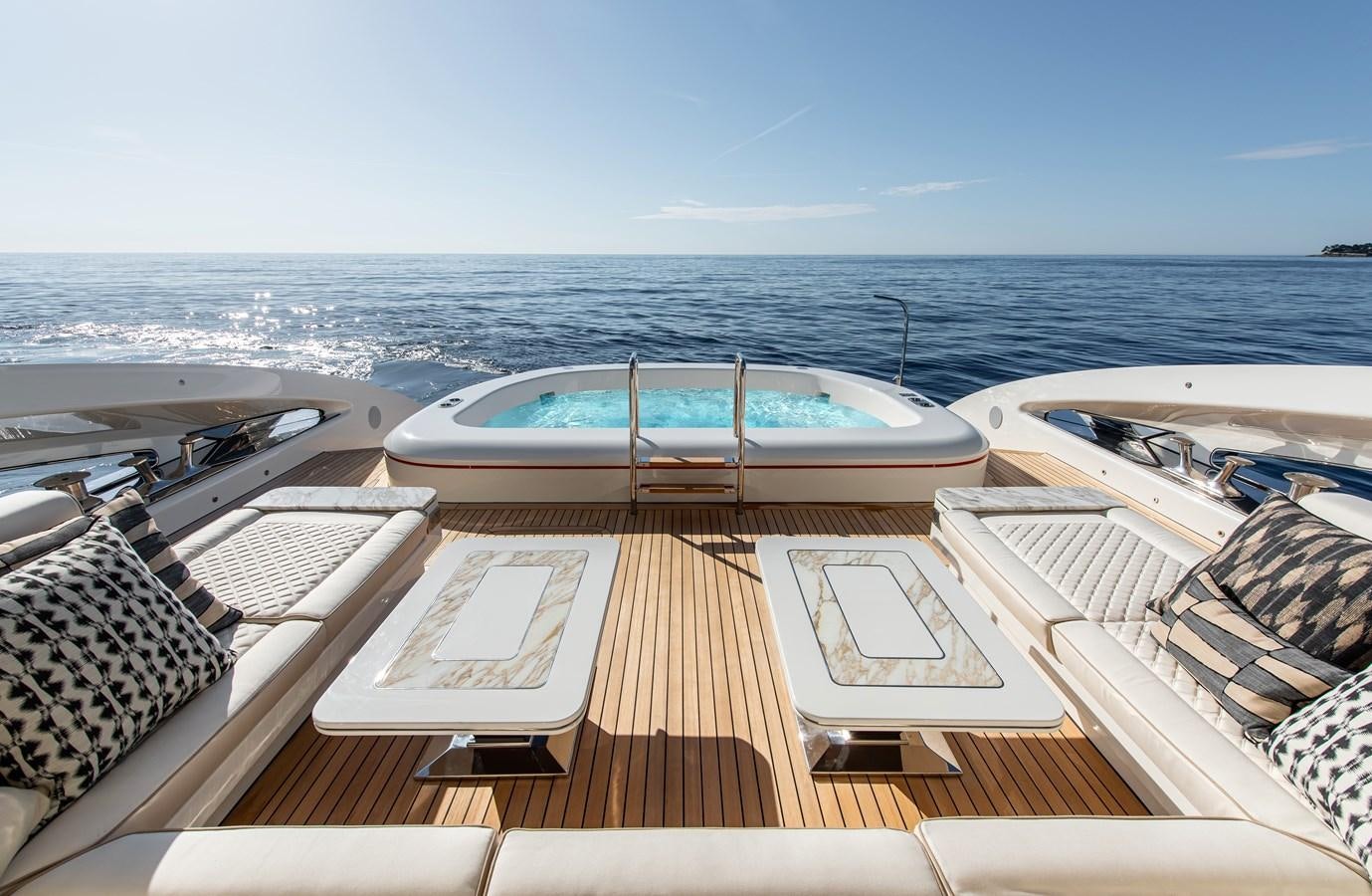 a deck with a pool and a boat on it aboard STEFANIA Yacht for Sale