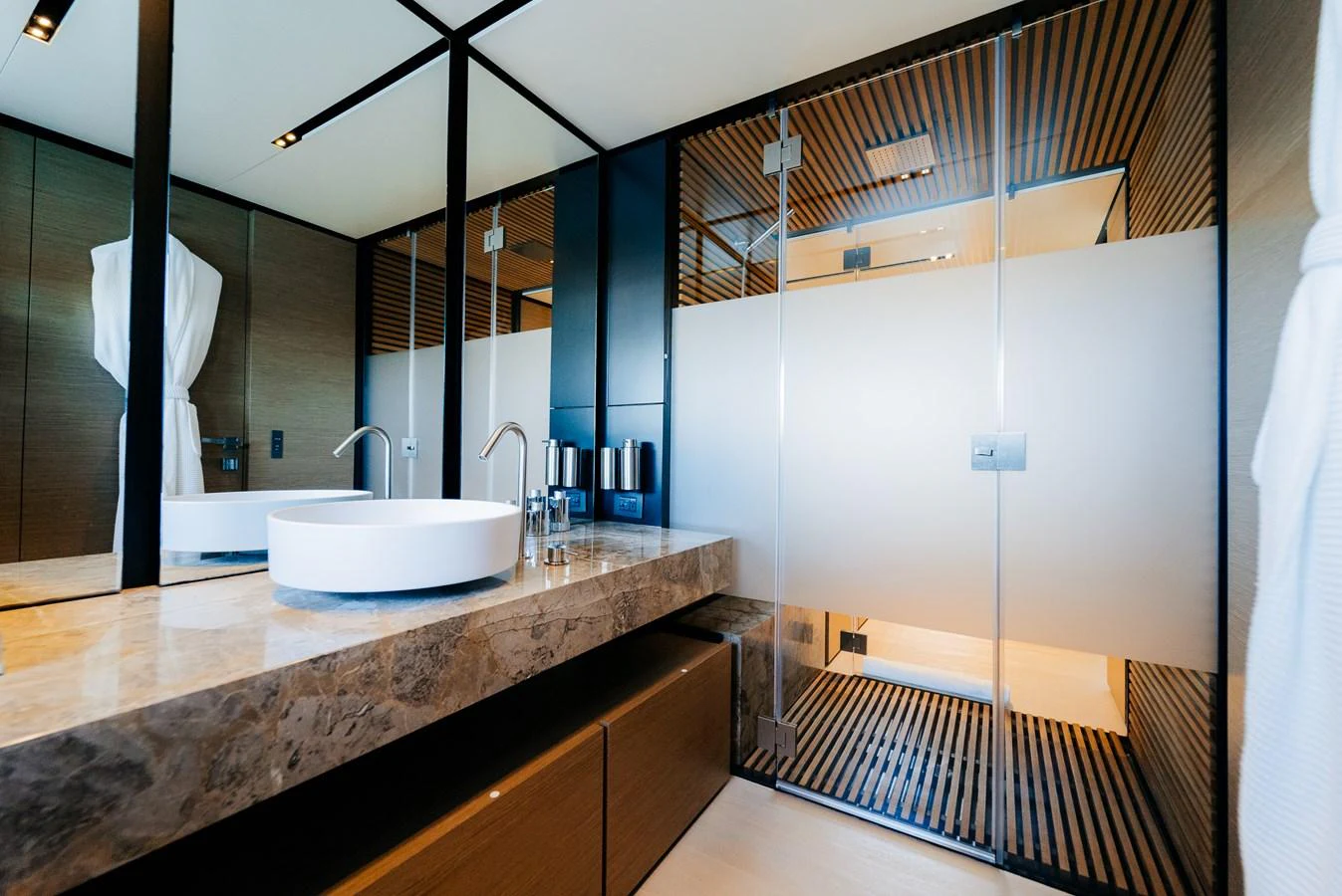 a bathroom with a sink and a mirror aboard COFINA Yacht for Sale