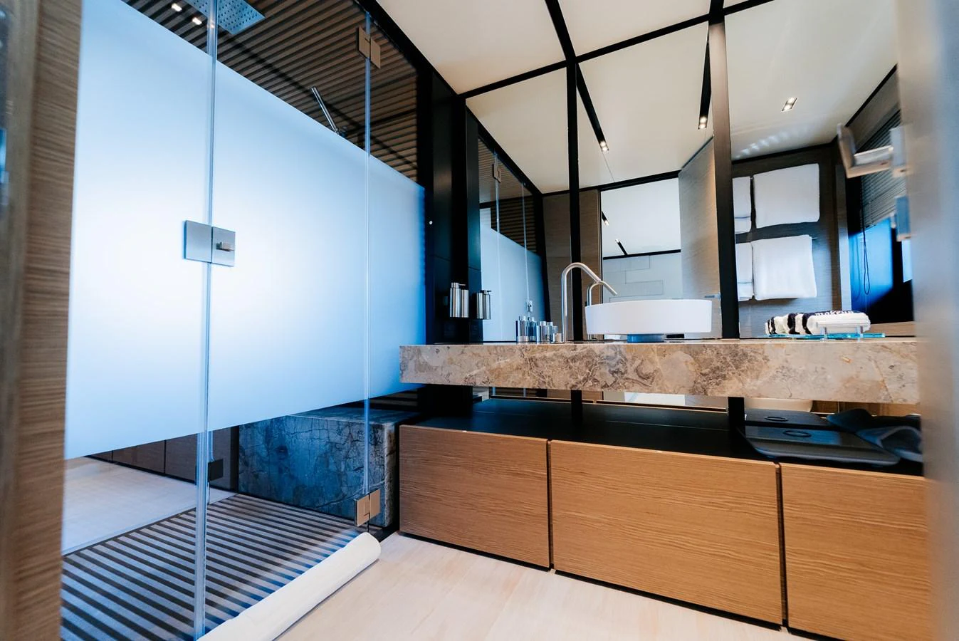 a kitchen with a large glass shower aboard COFINA Yacht for Sale
