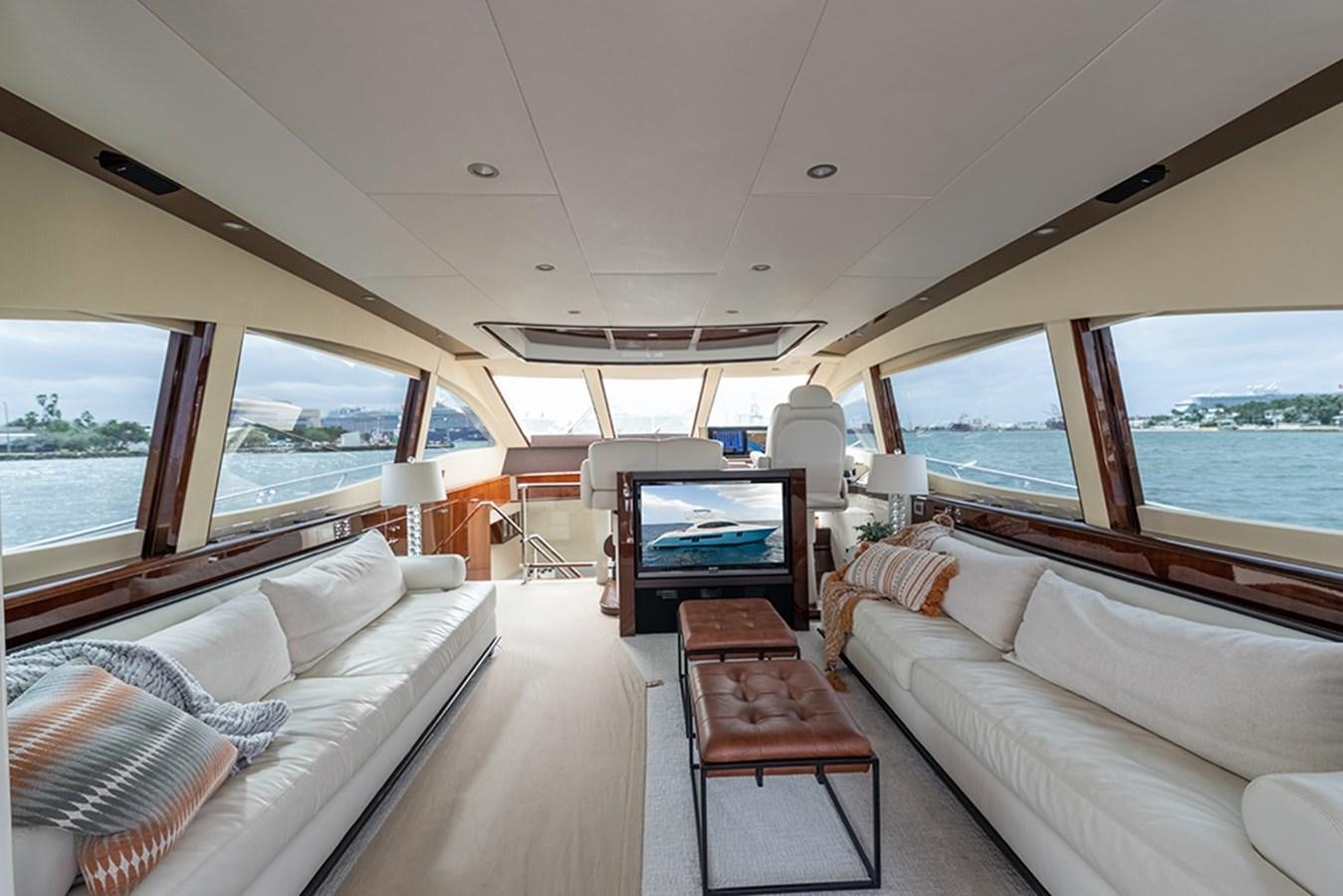 a living room with a large window aboard LATITUDE Yacht for Sale