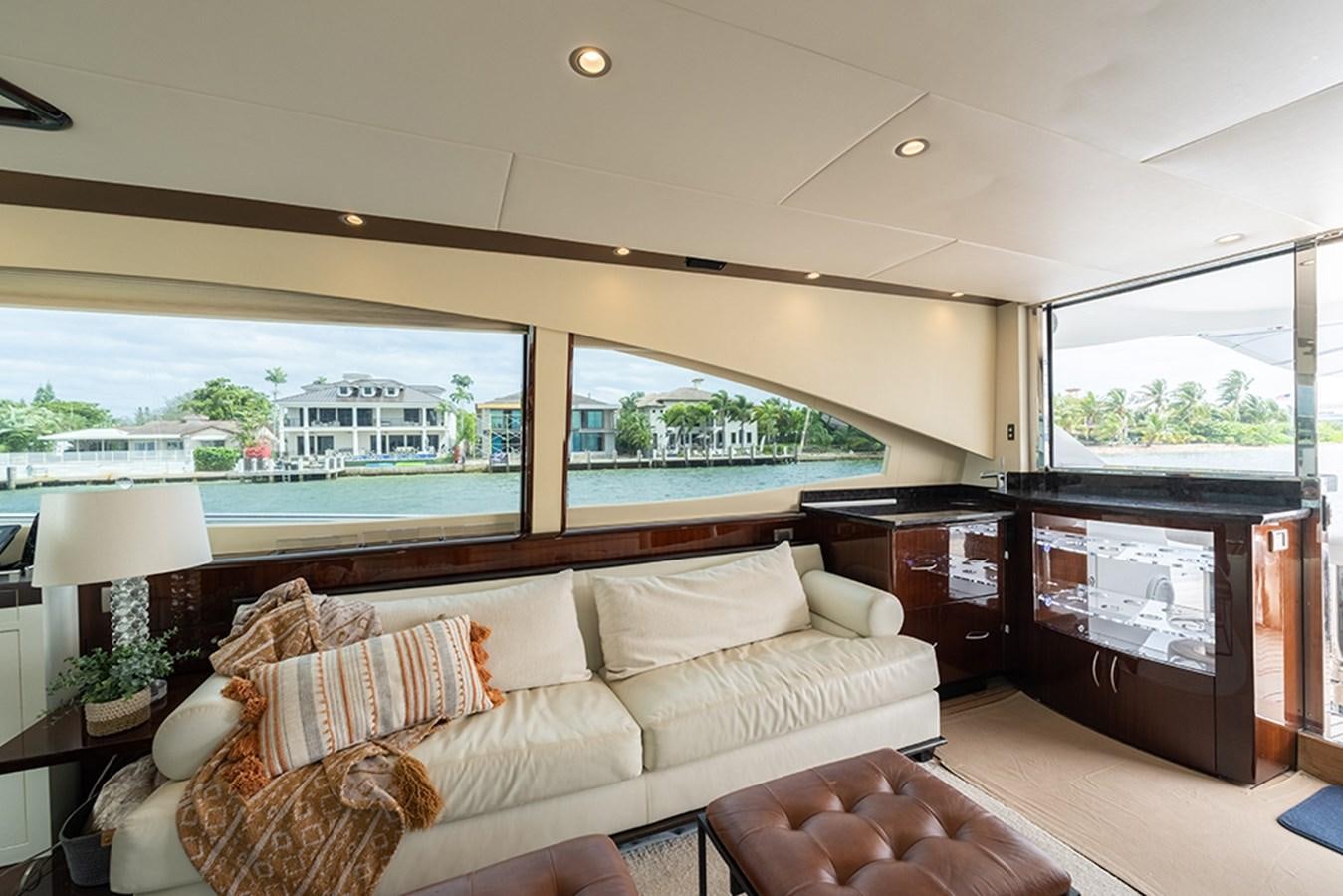 a living room with a large window aboard LATITUDE Yacht for Sale