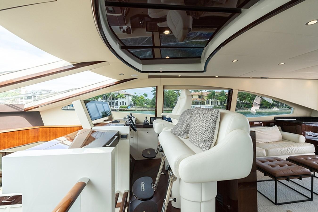 inside of a vehicle with a laptop on the table aboard LATITUDE Yacht for Sale