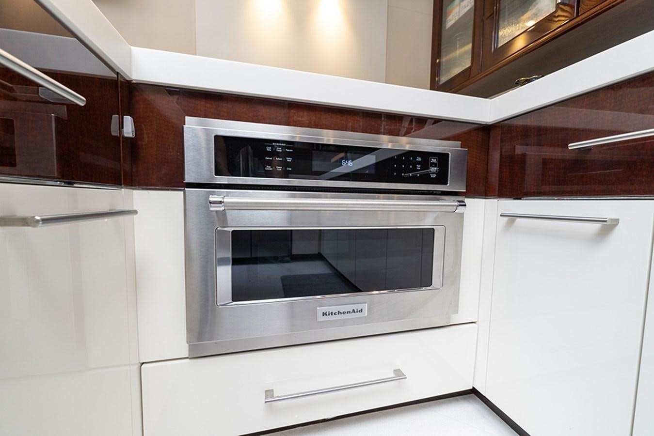 a white stove in a kitchen aboard LATITUDE Yacht for Sale