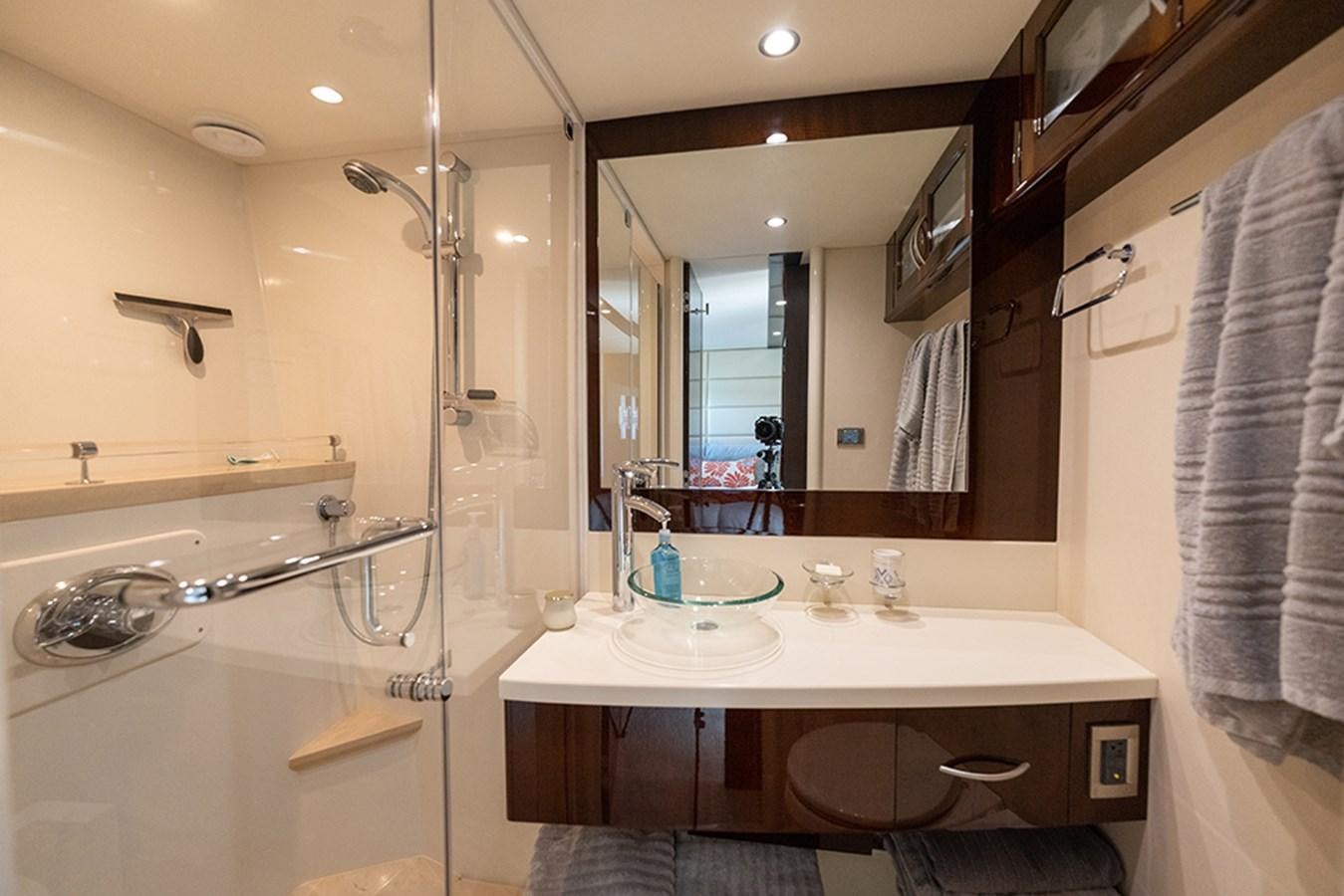 a bathroom with a large mirror aboard LATITUDE Yacht for Sale