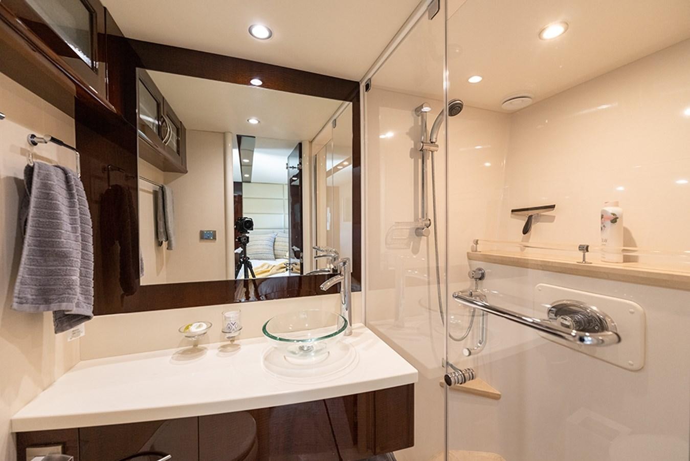 a bathroom with a large mirror aboard LATITUDE Yacht for Sale