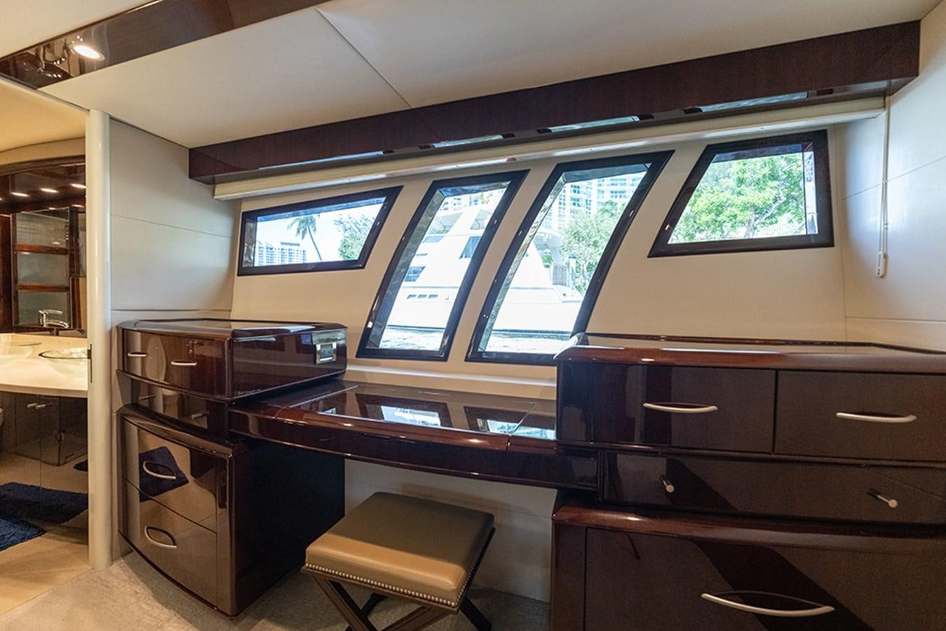 a room with a desk and a window aboard LATITUDE Yacht for Sale